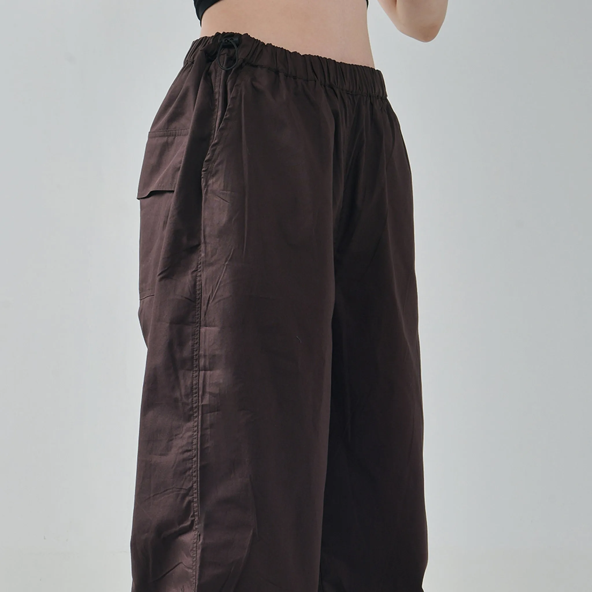 Black Ruffle Top & Brown Parachute Pants